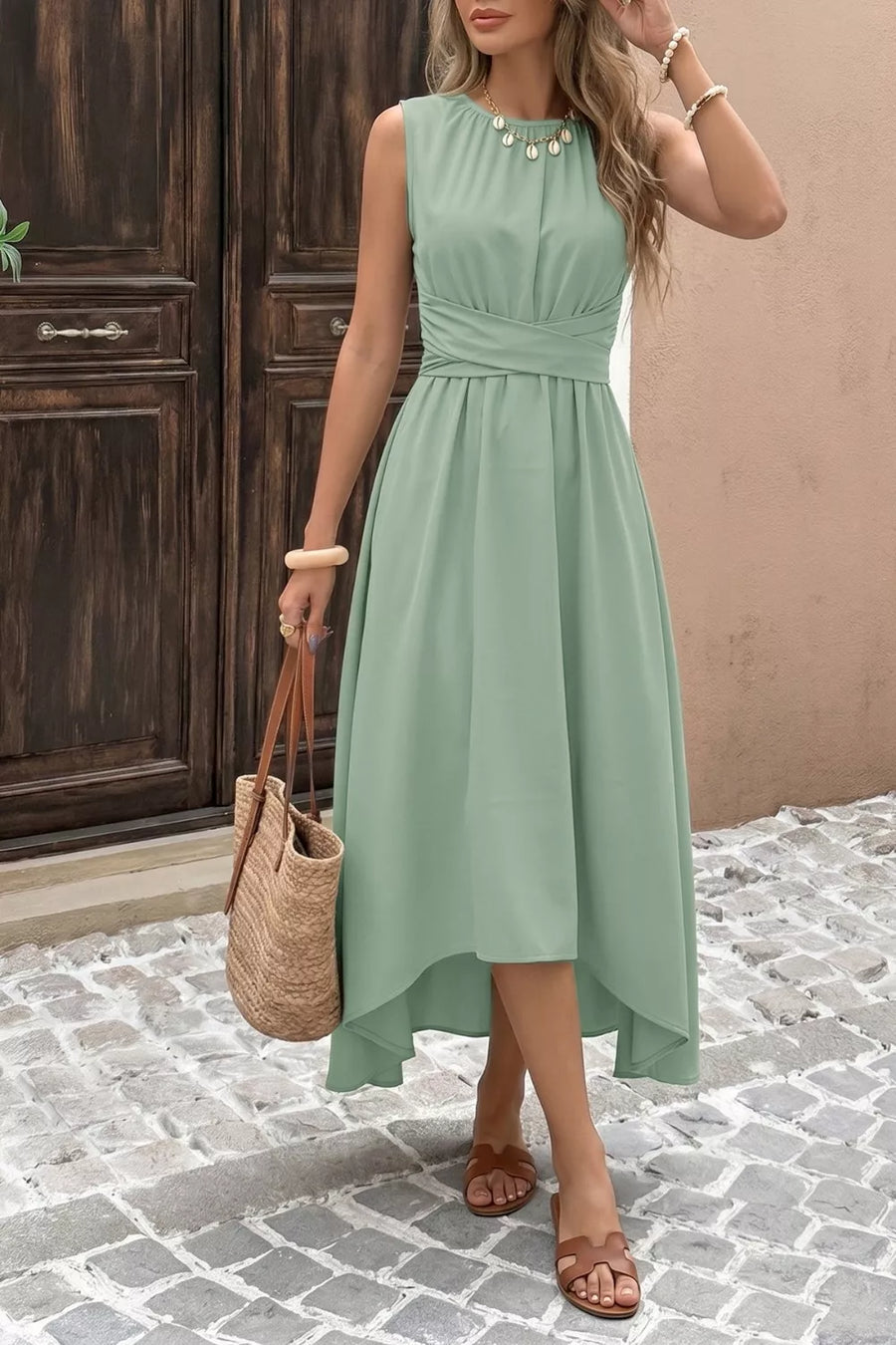 Sage green sleeveless high-low a-line dress with ruched waist and tie belt