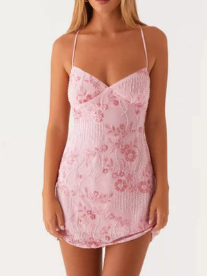 Blush pink embellished floral mini dress with beaded details and spaghetti straps.