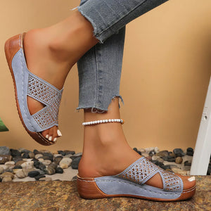 Sky blue open toe wedge sandals with criss-cross straps and rhinestone embellishments.