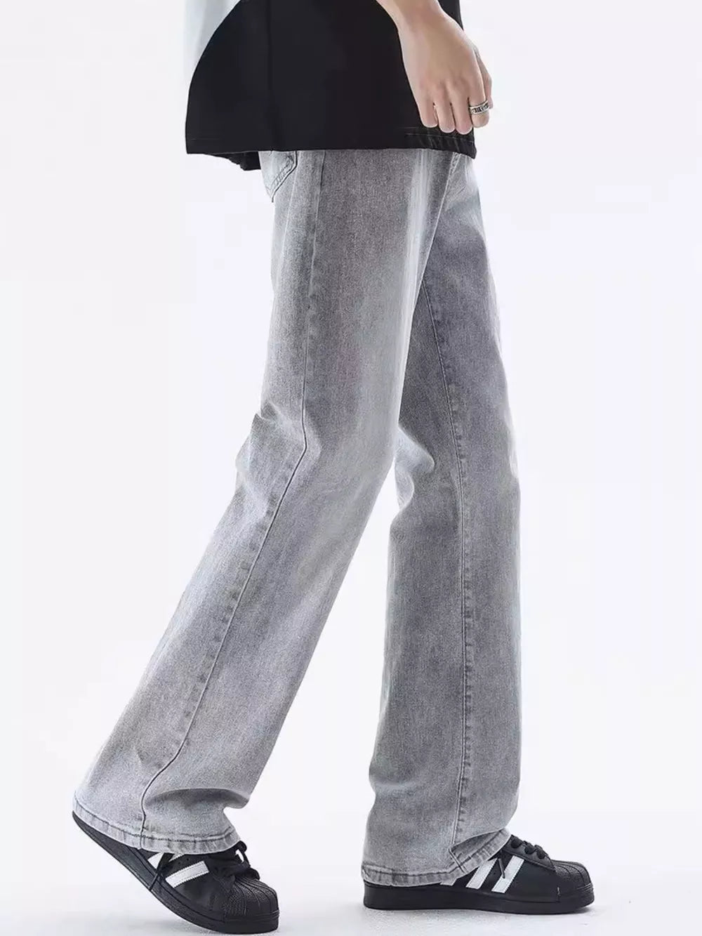 Men's relaxed fit light grey washed cotton jeans with a vintage-inspired look.