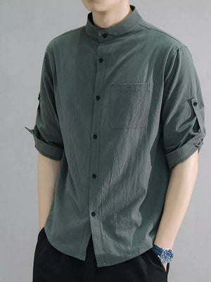 Men's army green cotton shirt with roll-up sleeves and chest pocket.