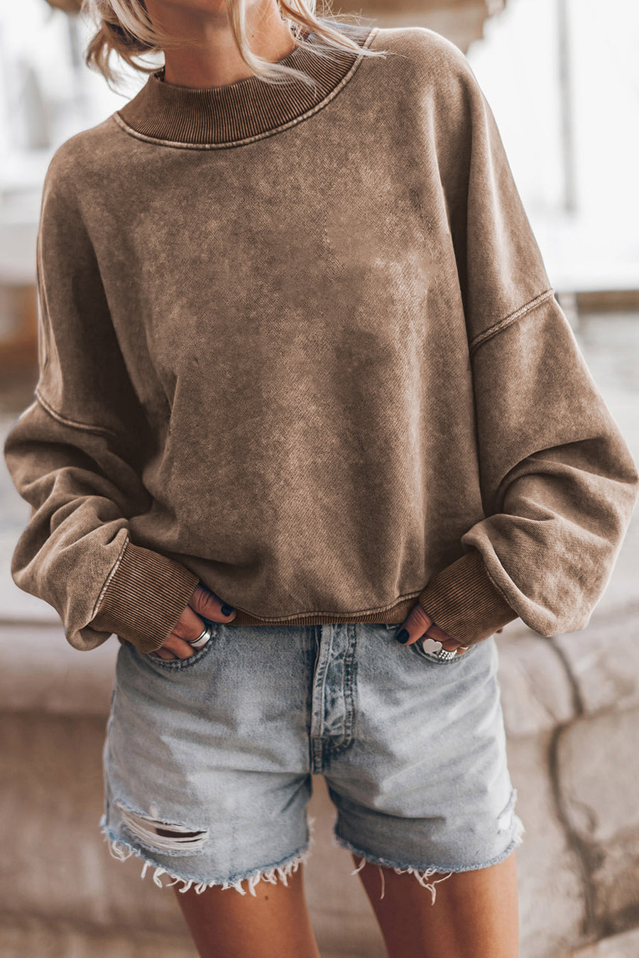 Acid wash mock neck sweatshirt in taupe with ribbed cuffs and neckline.