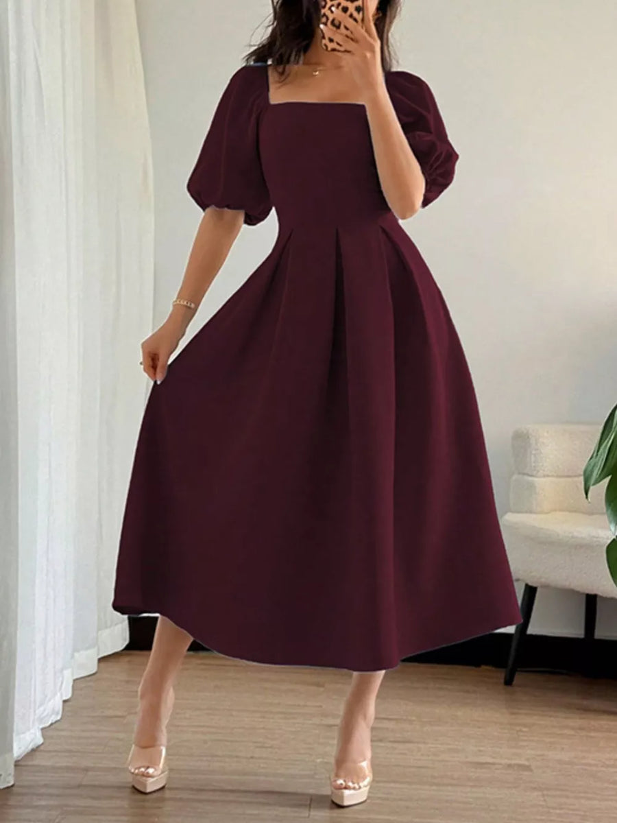 Burgundy midi dress with square neck, flutter sleeves, and pleated A-line skirt.