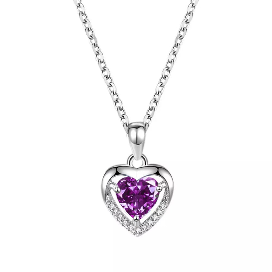 Elegant heart pendant necklace with purple zircon and clear accent stones on a silver chain.