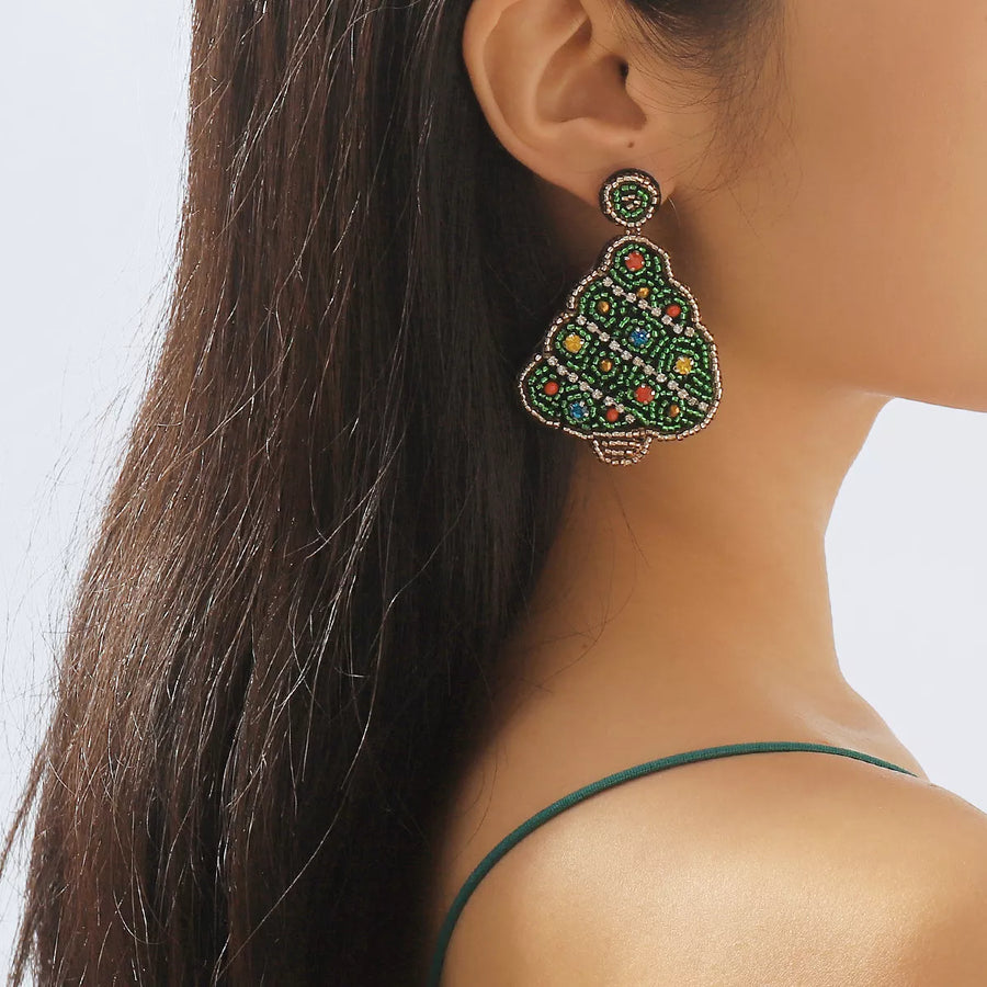 Festive tree dangle earrings in dark green, adorned with colorful beads and crystals.