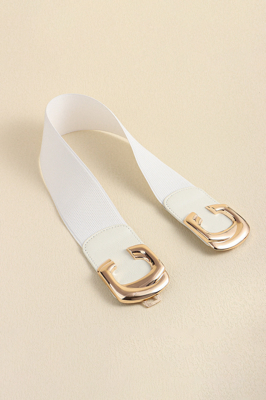 White elastic belt with double C gold buckle and faux leather trim