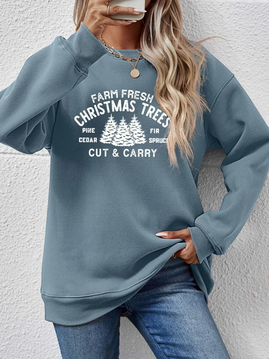 Misty Blue crewneck sweatshirt with "Farm Fresh Christmas Trees" graphic print and crew neckline.