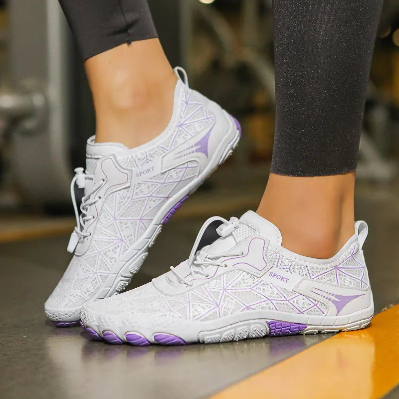 White mesh barefoot water shoes with geometric pattern and purple accents.