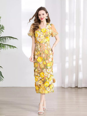 Sheath dress in sheer tan with yellow floral embroidery, short sleeves, V-neck, knee-length.