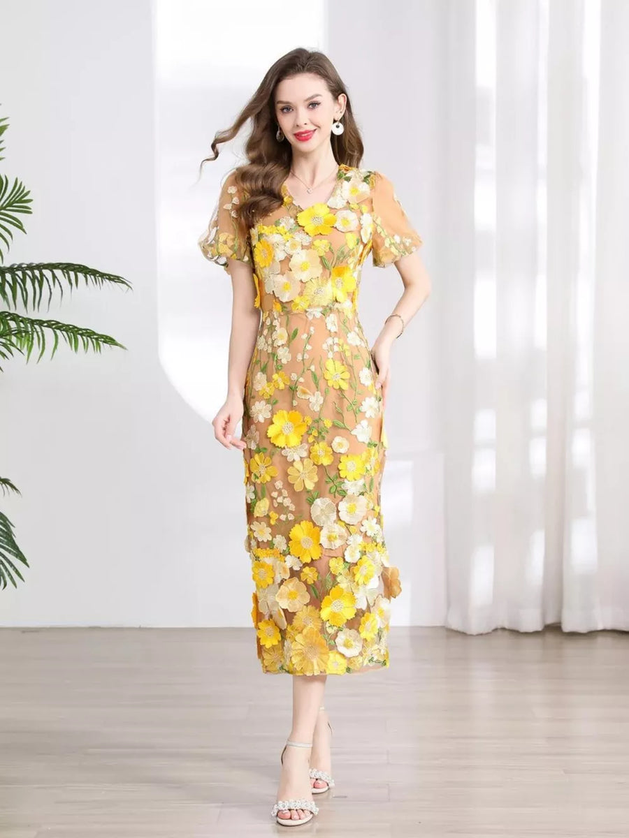 Sheath dress in sheer tan with yellow floral embroidery, short sleeves, V-neck, knee-length.