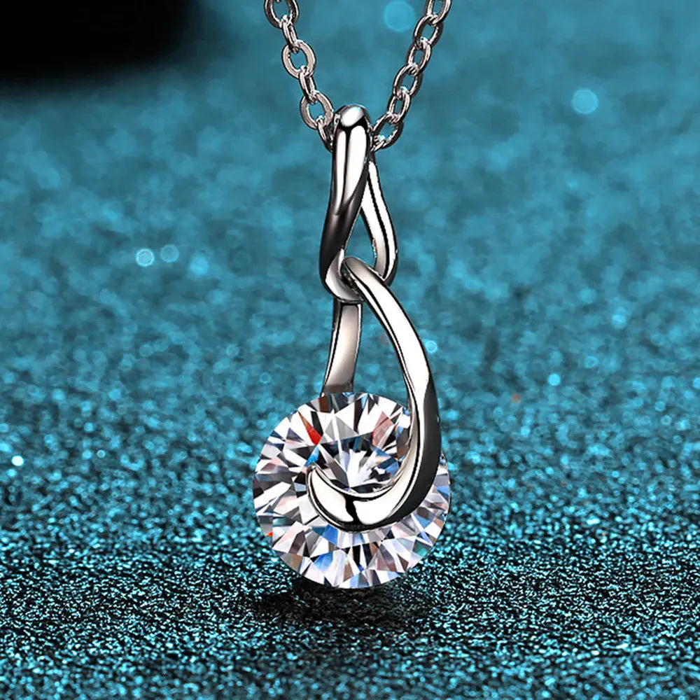 Orbital solitaire pendant necklace in silver with a round-cut crystal.