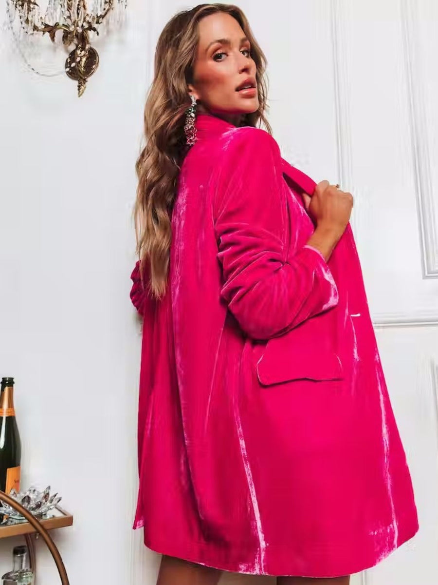 Hot Pink velvet blazer with drape front and button closure, featuring flap pockets.