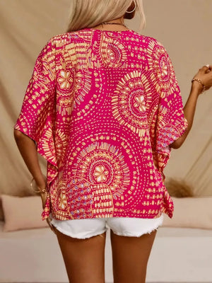 Bohemian print V-neck t-shirt in hot pink with short sleeves and a relaxed fit.