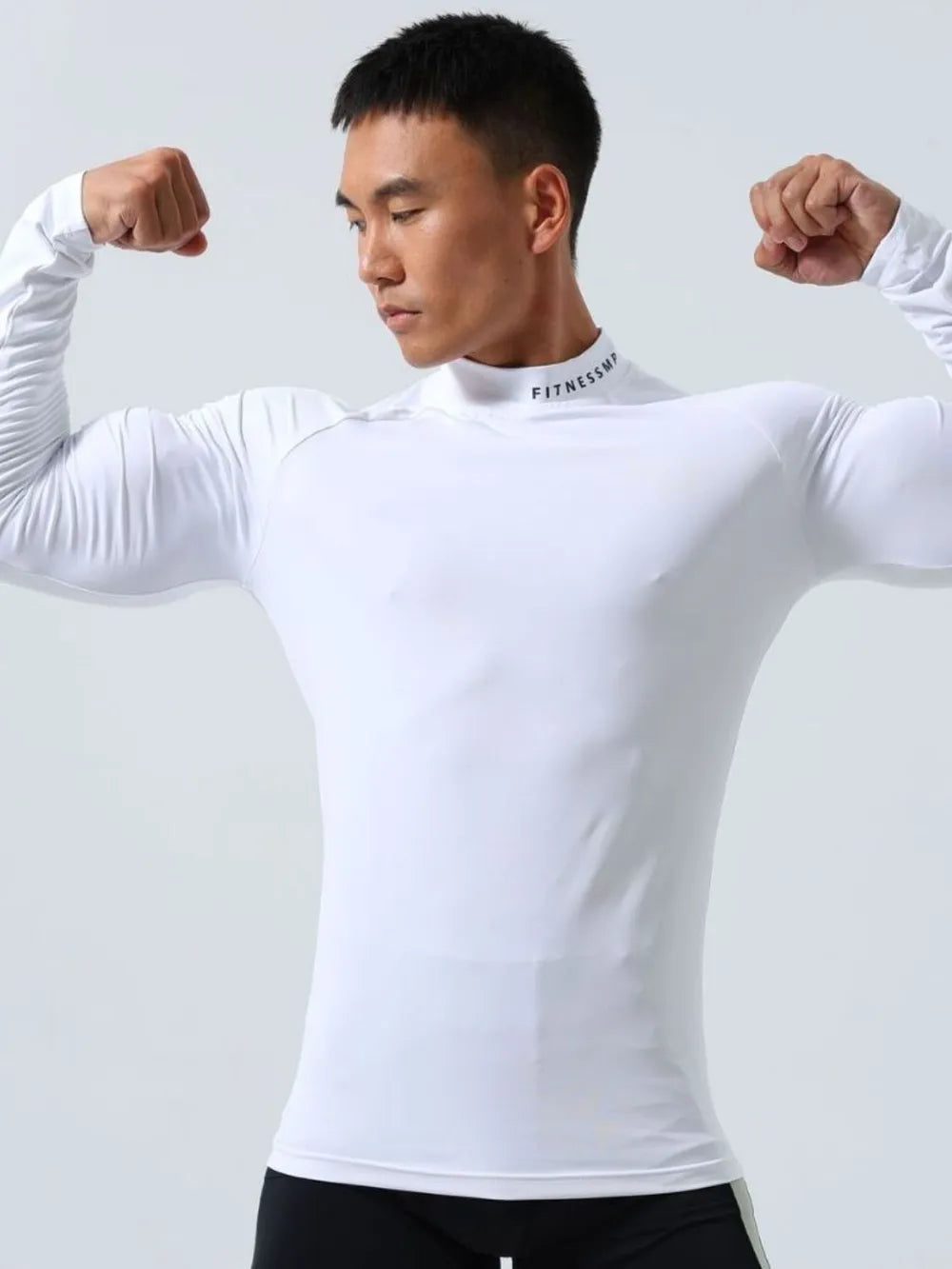 White long sleeve compression mock neck active top with subtle logo detail
