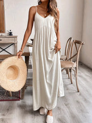 Effortless V-neck maxi dress in natural linen blend, with adjustable spaghetti straps and a gathered empire waist.