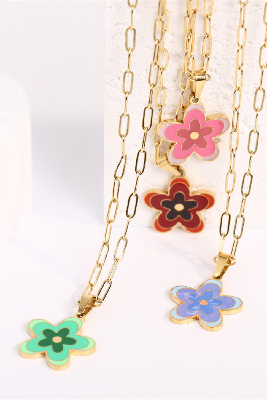 18K gold-plated chain necklaces with colorful enamel floral pendants in green, pink, red, and blue.