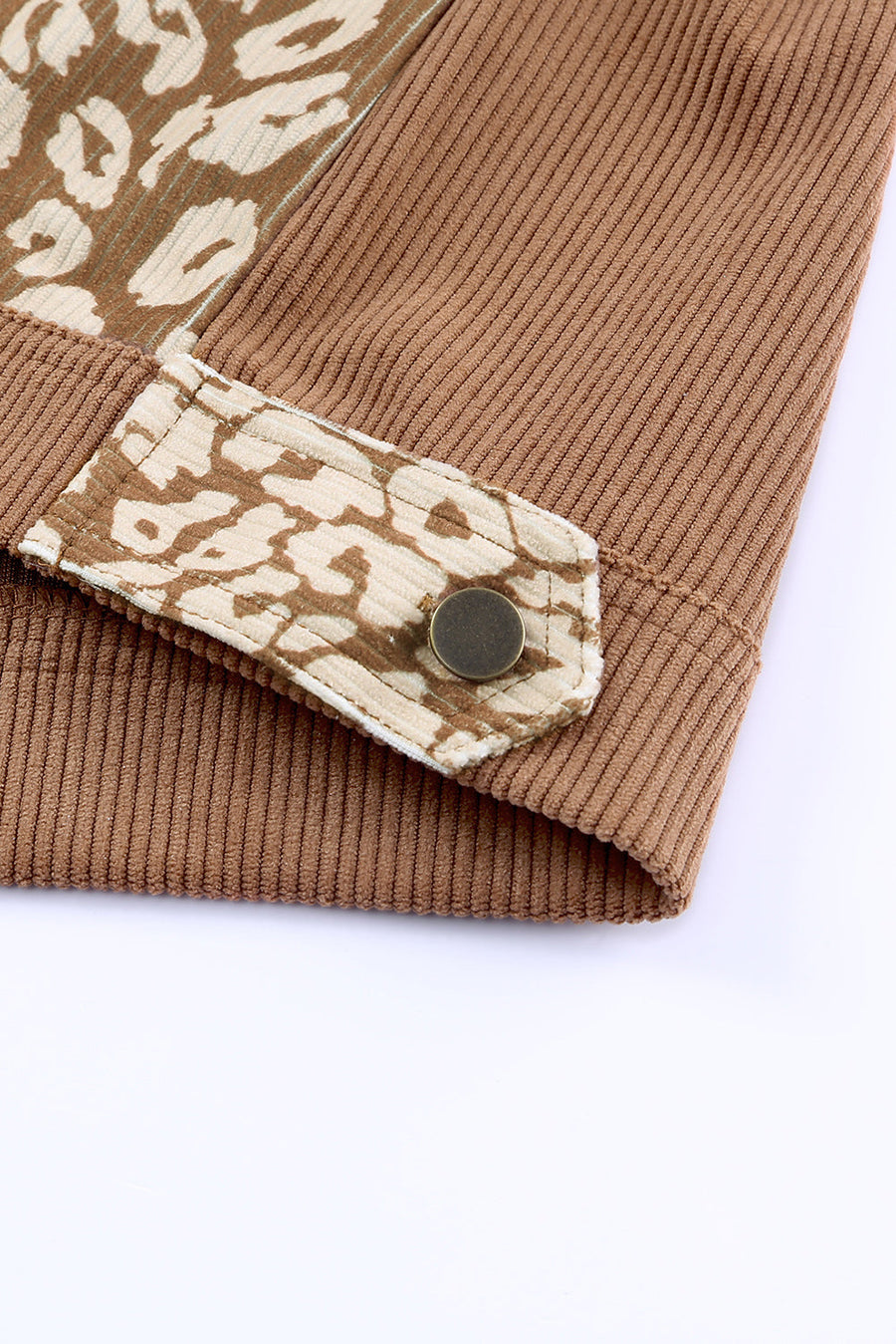 Corduroy jacket in camel with leopard print panel detail and button closure.