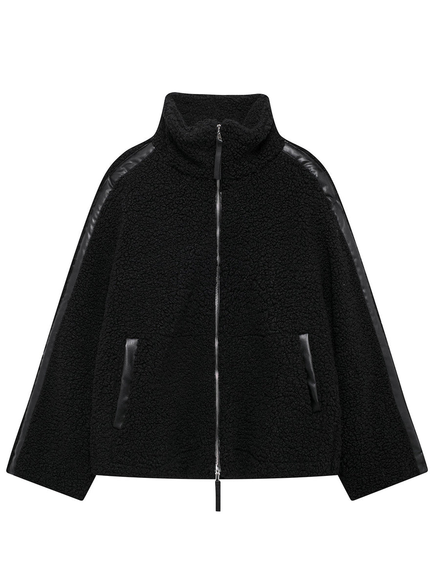 Black teddy fleece zip-up jacket with contrast piping and faux leather trim.
