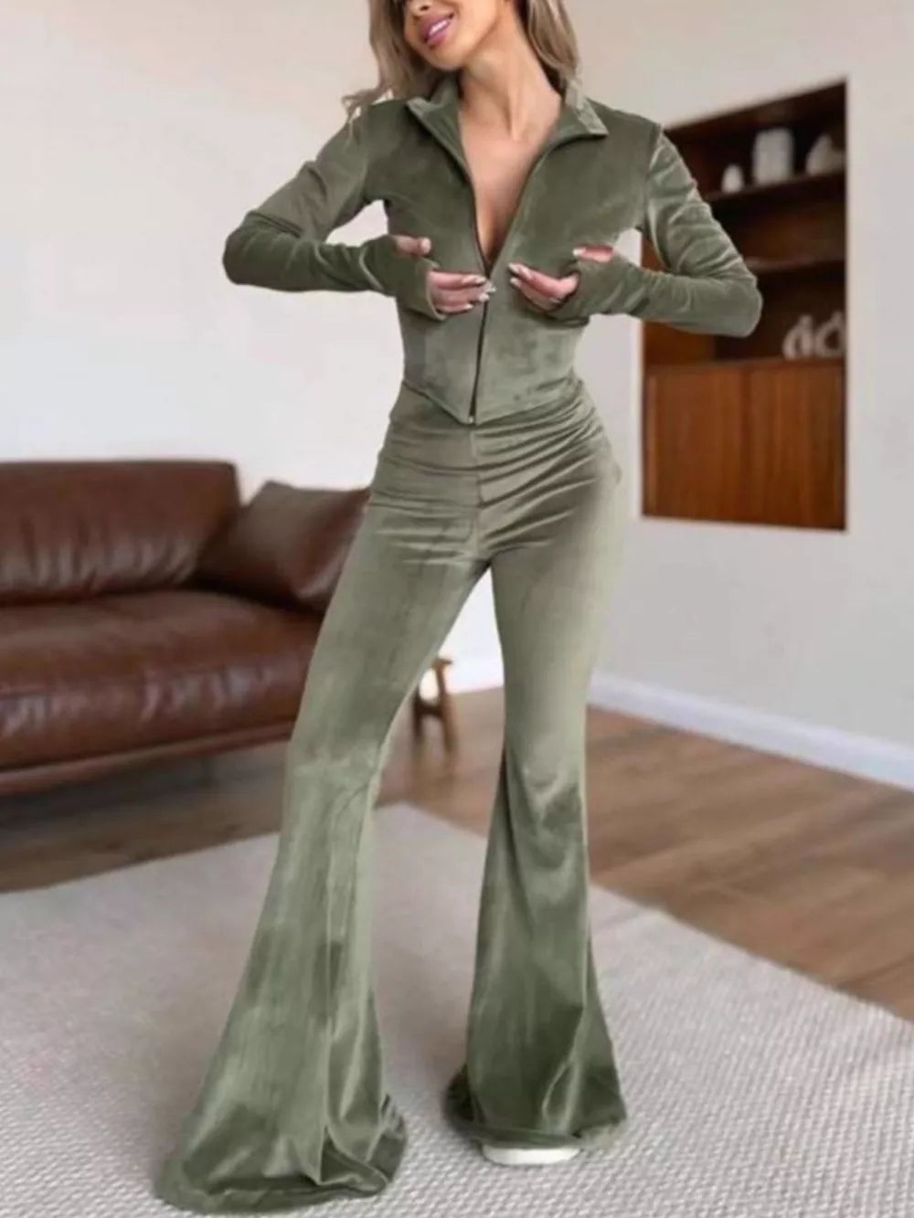 100% polyester Care instructions: Machine wash cold two-piece set in Black with fitted top, flared pants silhouette