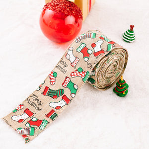 Festive holiday ribbon in beige burlap with a Merry Christmas stocking pattern in red and green.