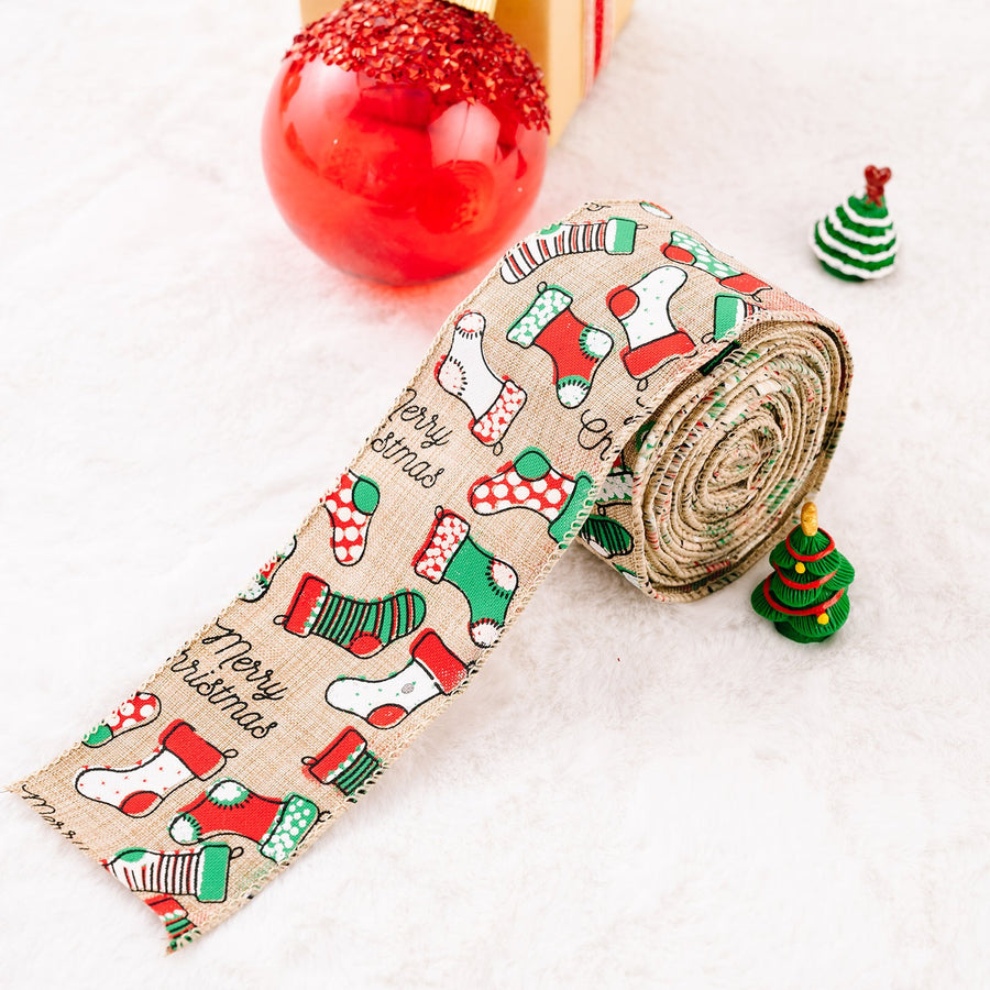 Festive holiday ribbon in beige burlap with a Merry Christmas stocking pattern in red and green.