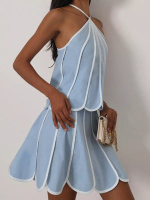 Light blue scalloped hem mini dress with white trim and halter neck.