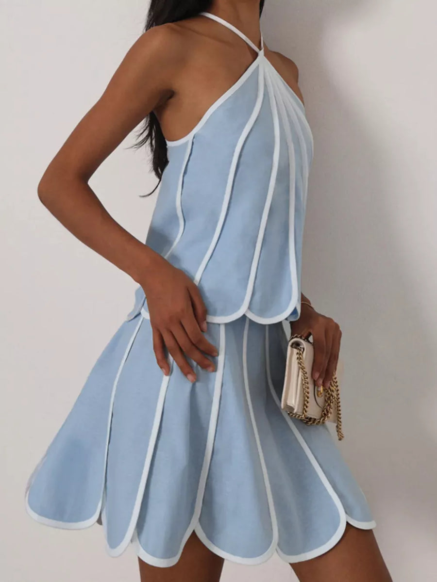 Light blue scalloped hem mini dress with white trim and halter neck.