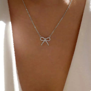 Silver bowknot pendant necklace with pave crystals on a delicate chain