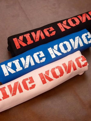 King Kong graphic tees in black, blue, and dusty pink with distressed text print.
