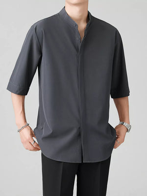 Dark gray oversized Mandarin collar overshirt with half sleeves and button-down front.
