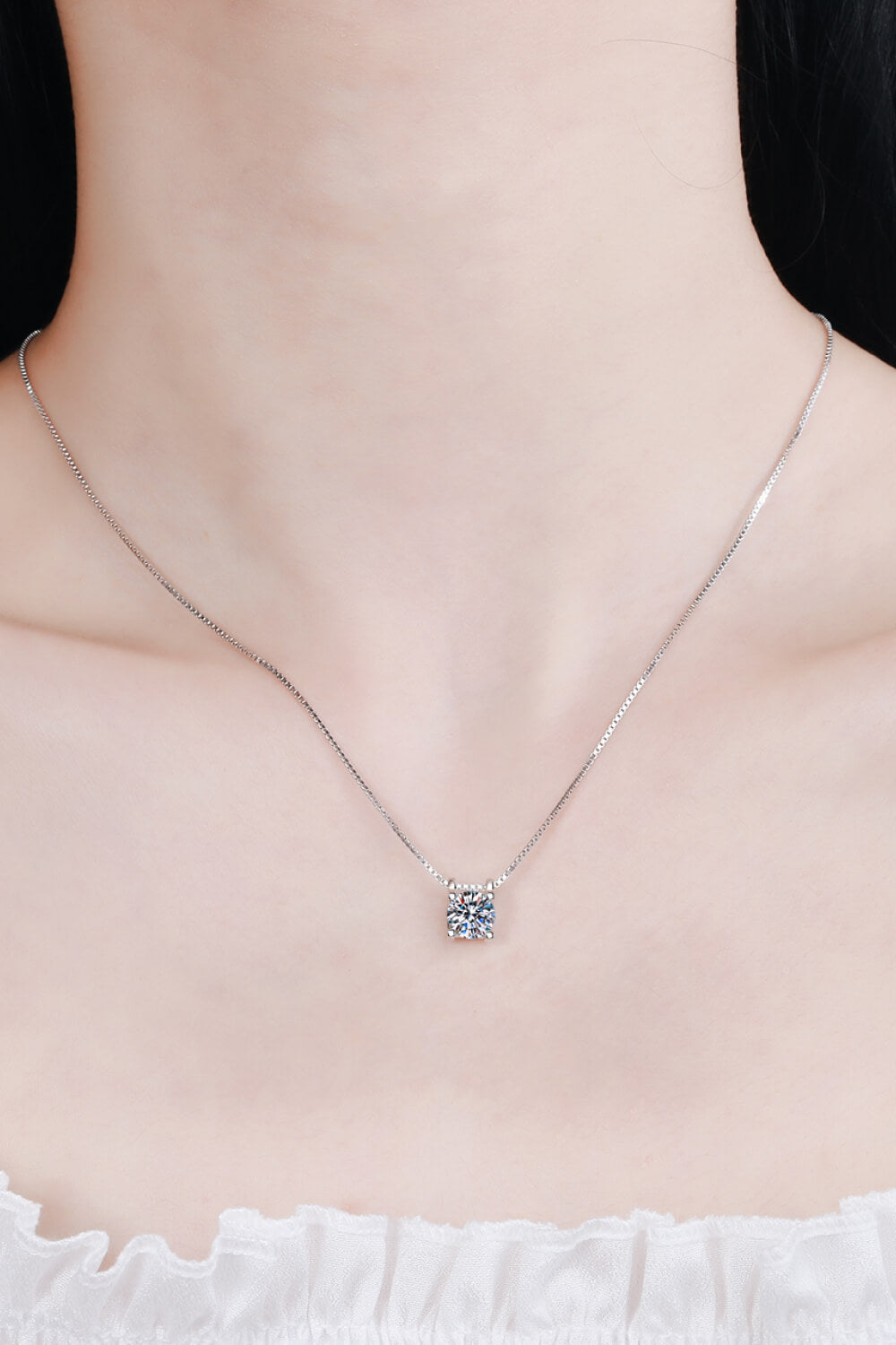 Sterling silver pendant necklace with a solitaire moissanite stone.