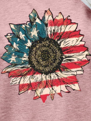 Sunflower Americana graphic tee in blush pink with distressed flag-inspired petals.