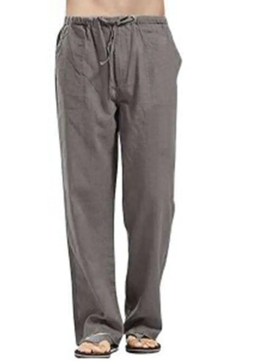 Relaxed fit gray linen drawstring trousers with pockets and a straight leg.