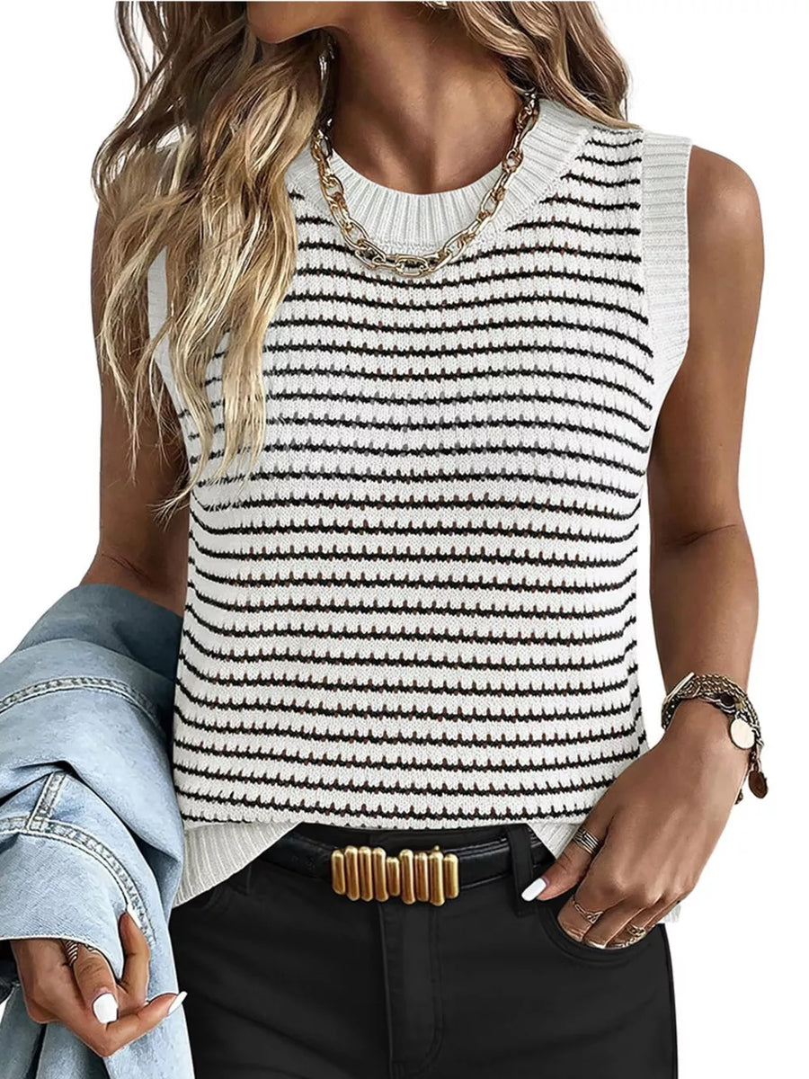 White and black striped knit sweater vest with crewneck and textured detail.