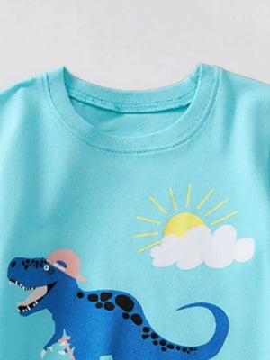 Kids blue t-shirt with a graphic of a blue dinosaur wearing a pink hat and a sun with clouds.