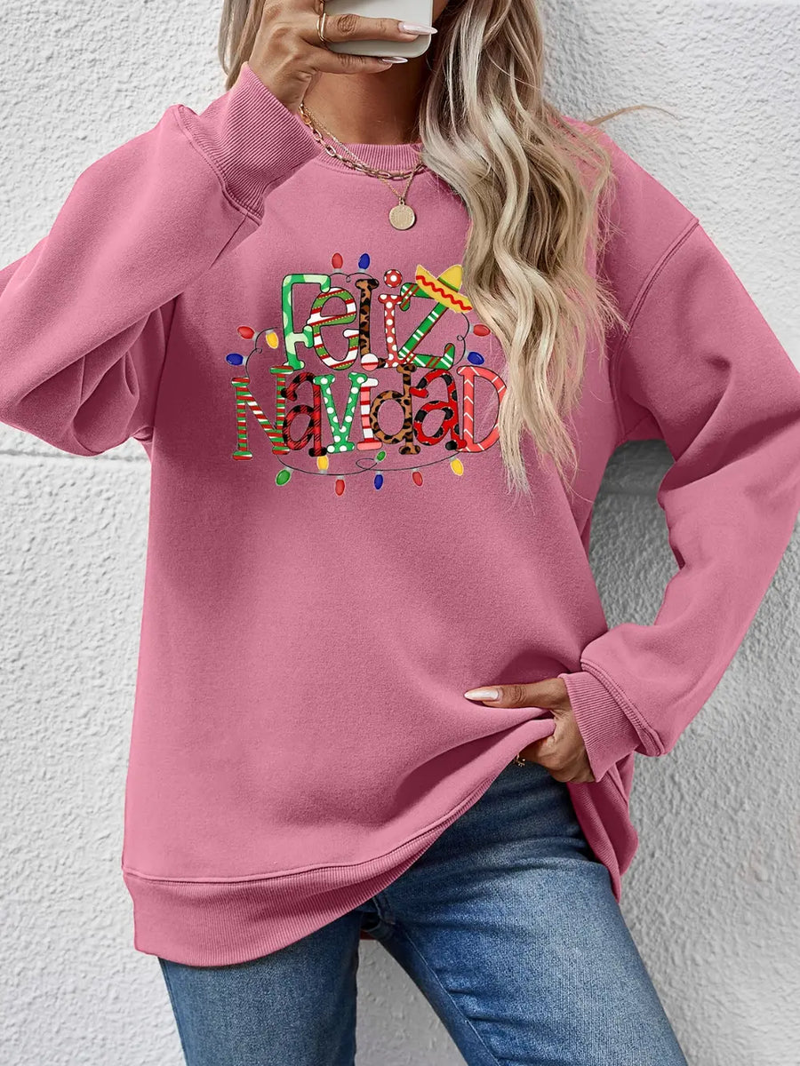 Blush pink raglan sweatshirt with Feliz Navidad graphic and Christmas lights.