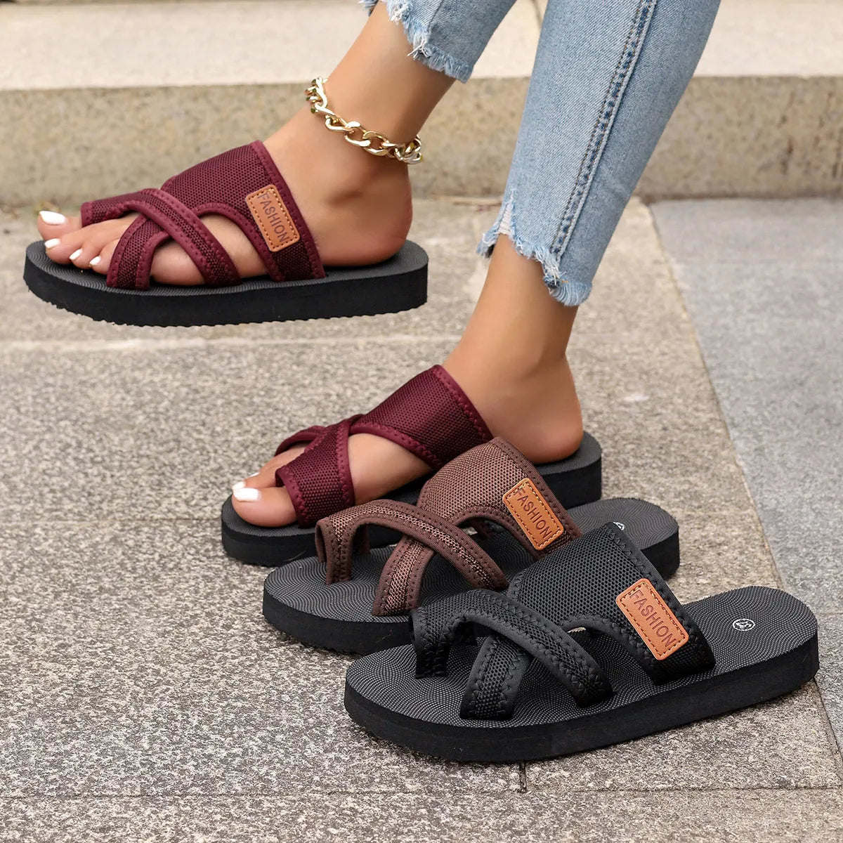 Cross-strap mesh platform slides in brown, black, and deep purple.