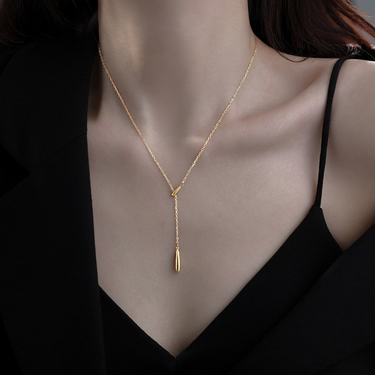 Gold Y-shaped pendant necklace with a drop charm, 18k gold-plated.