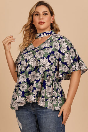 Dark blue floral peplum blouse with keyhole neckline and flutter sleeves