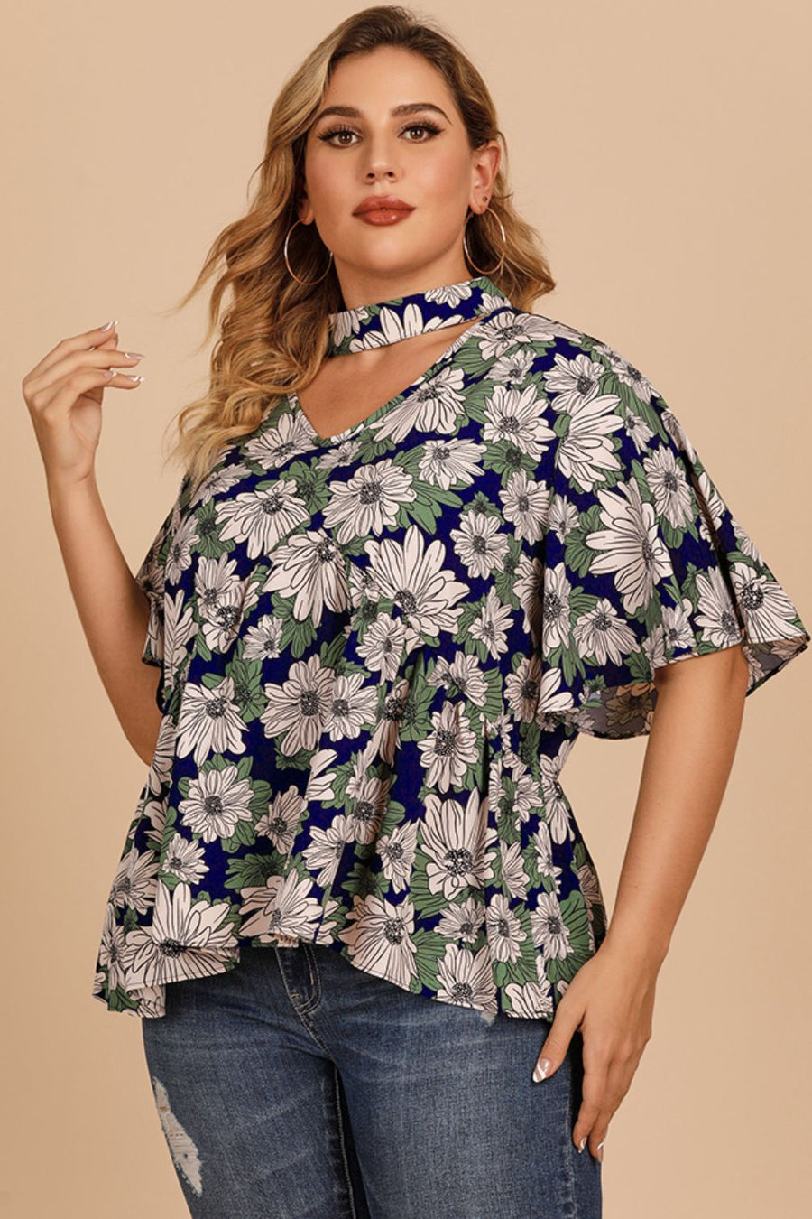 Dark blue floral peplum blouse with keyhole neckline and flutter sleeves
