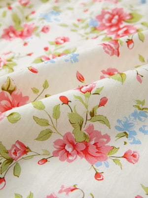 Floral pocketed puff sleeve dress in cotton with a vintage floral print.
