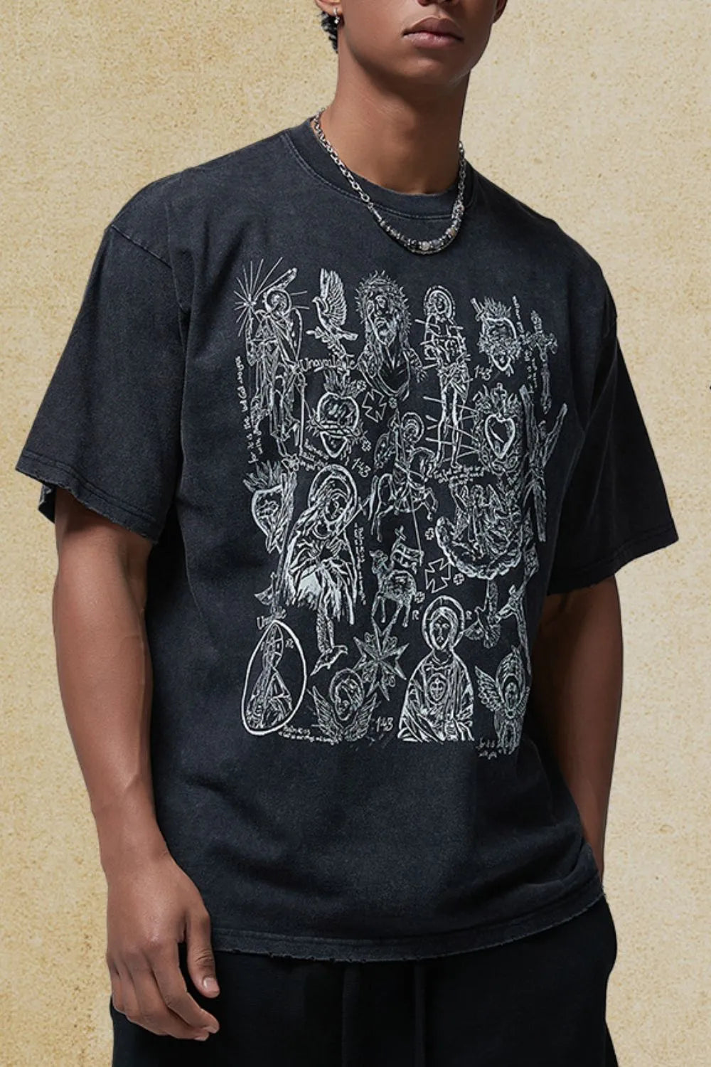 Black vintage wash t-shirt with religious icon graphic print