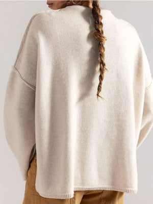 50% Viscose, 28% Polyester, 22% Polyamide Care instructions: Machine wash cold mock neck sweater in Black with relaxed