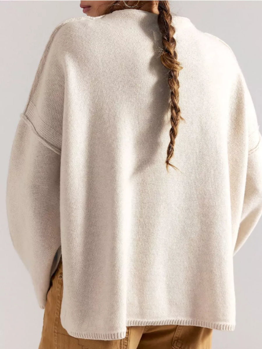 50% Viscose, 28% Polyester, 22% Polyamide Care instructions: Machine wash cold mock neck sweater in Black with relaxed