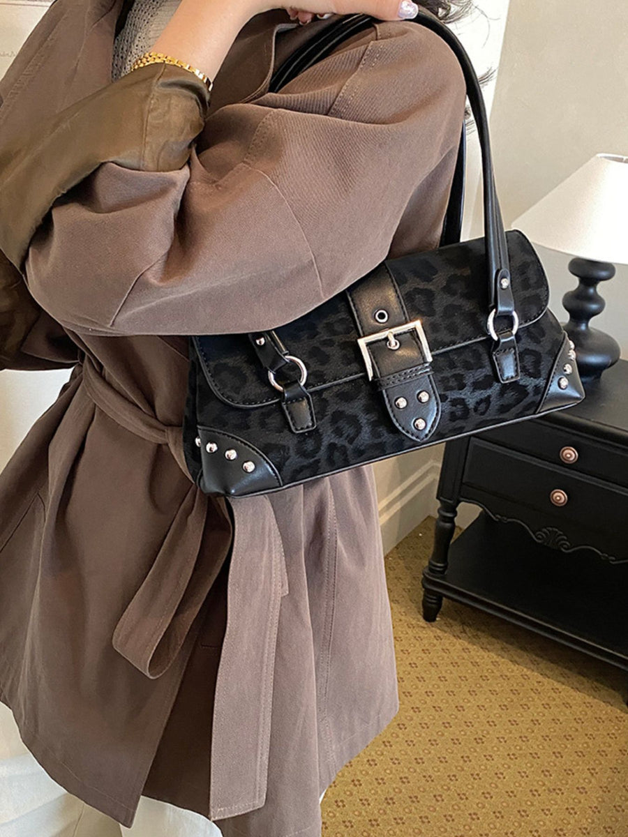 shoulder bag in black with leopard and buckle detail