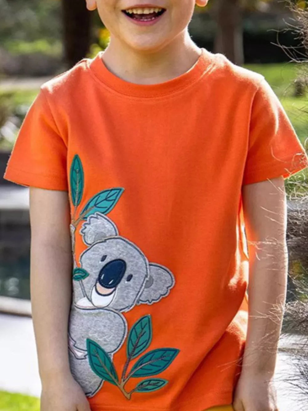 Adorable Koala Appliqué Toddler T-shirt with "Adventure Awaits" graphic.