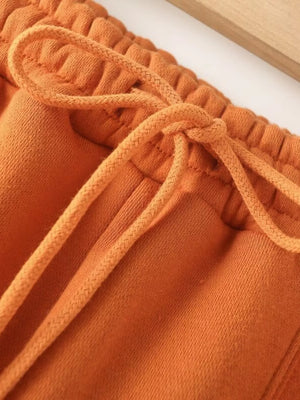 Orange casual wide-leg pants with drawstring waist detail