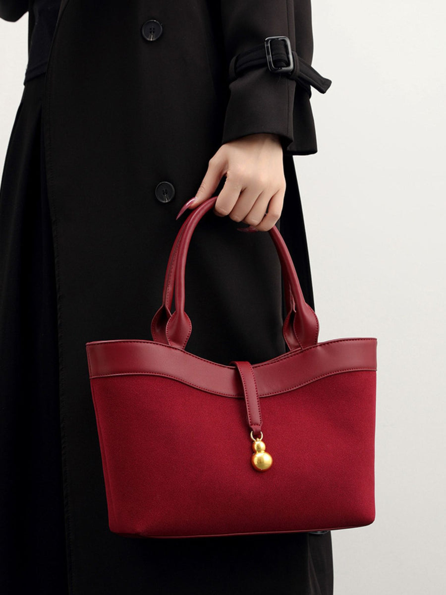 Suede Crossbody Bag With Gold Charm in Wine Red with adjustable strap