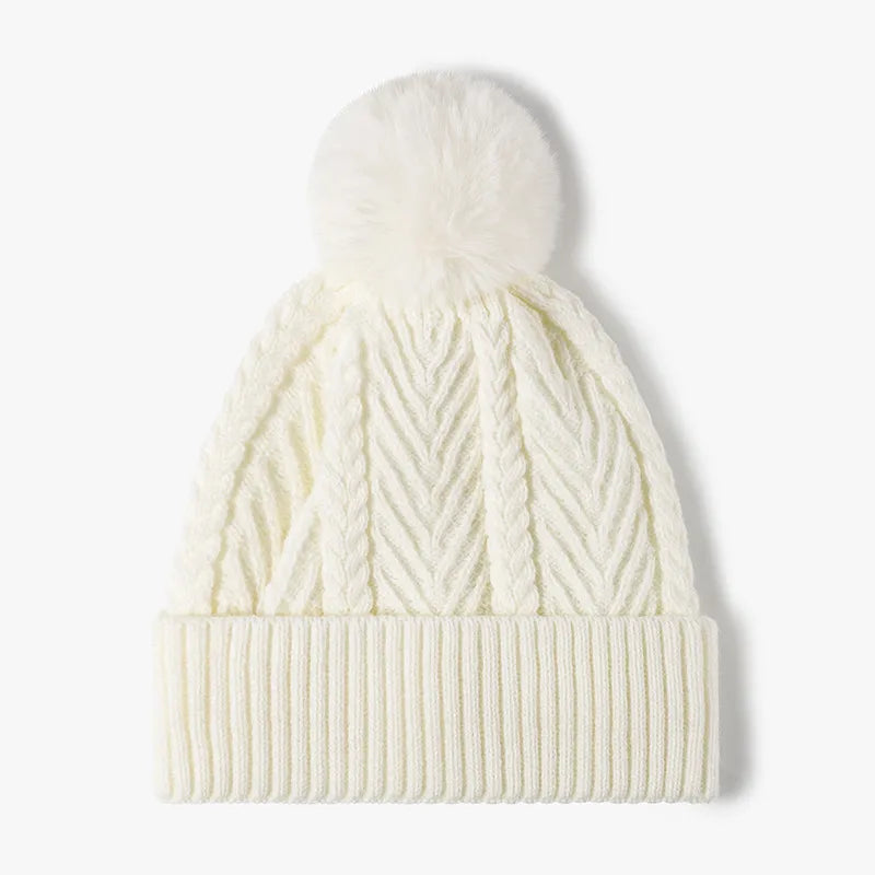 Cream chevron knit beanie with pom and cable details