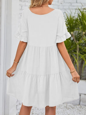 White ruffled sleeve mini dress with tiered skirt and pockets